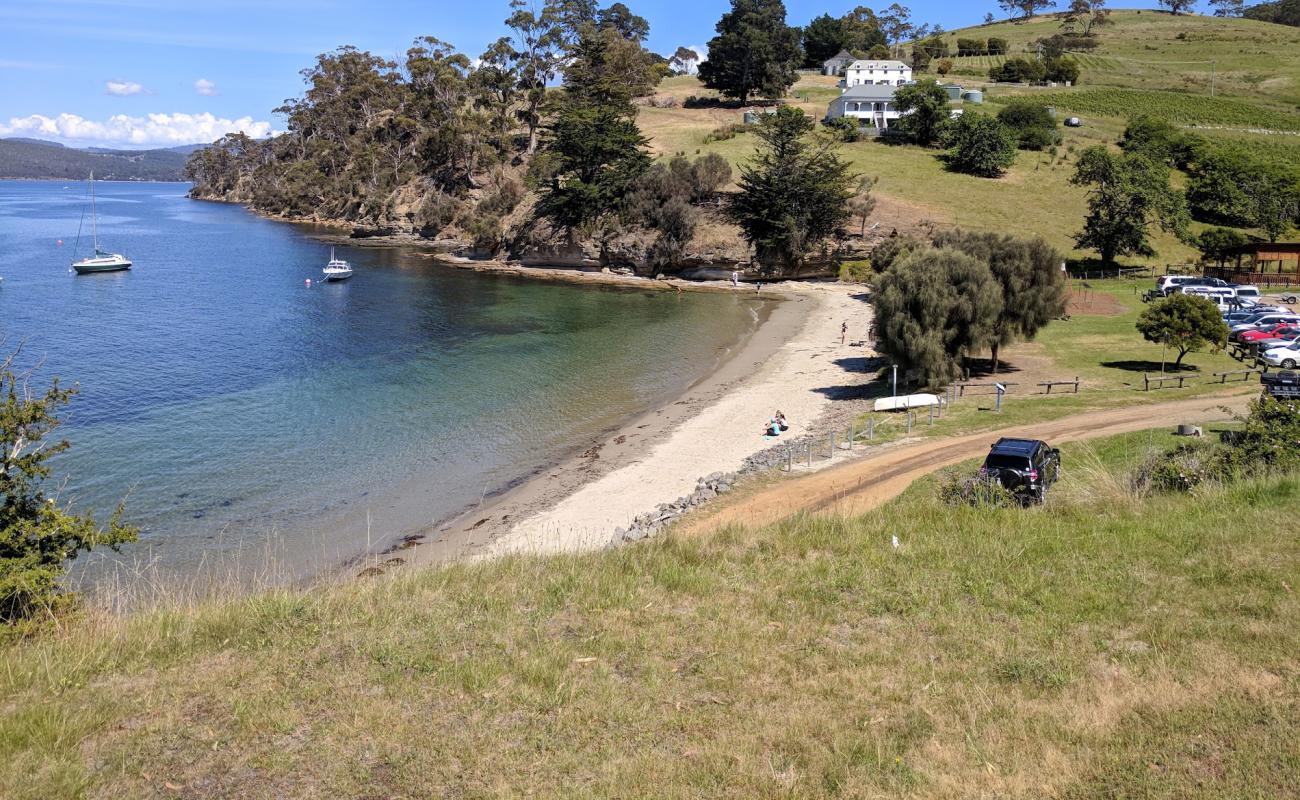 Photo of Tinderbox Beach with bright sand surface