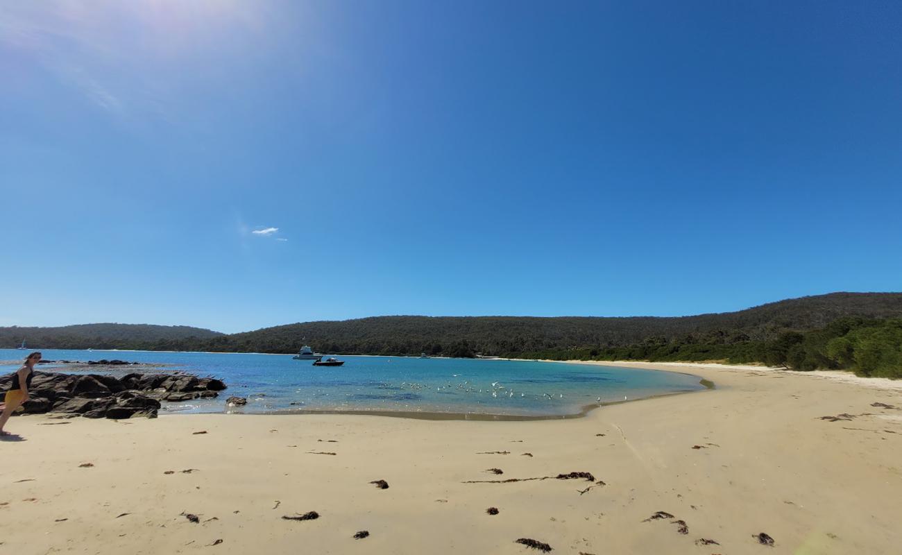 Photo of Motts Beach with bright sand surface