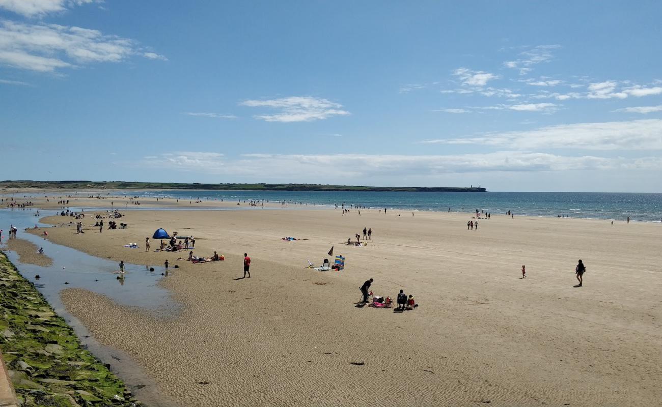 Photo of Tramore Beach with light sand &  pebble surface