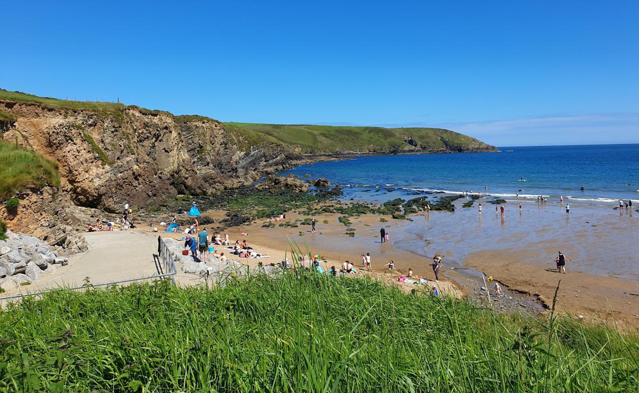 Photo of Rocky Bay Beach with bright sand & rocks surface