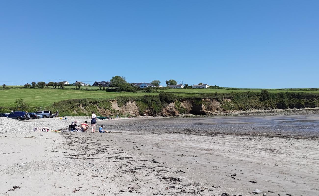 Photo of Broadstrand Bay Beach with bright sand & rocks surface