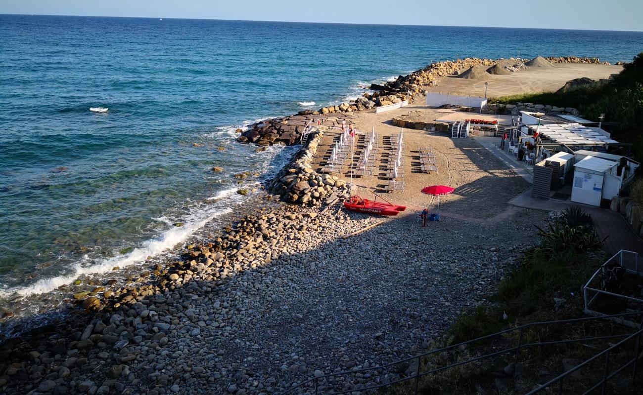 Photo of La Caletta beach with brown pebble surface