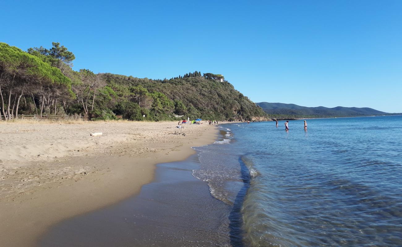 Photo of Cala Civette with brown sand surface