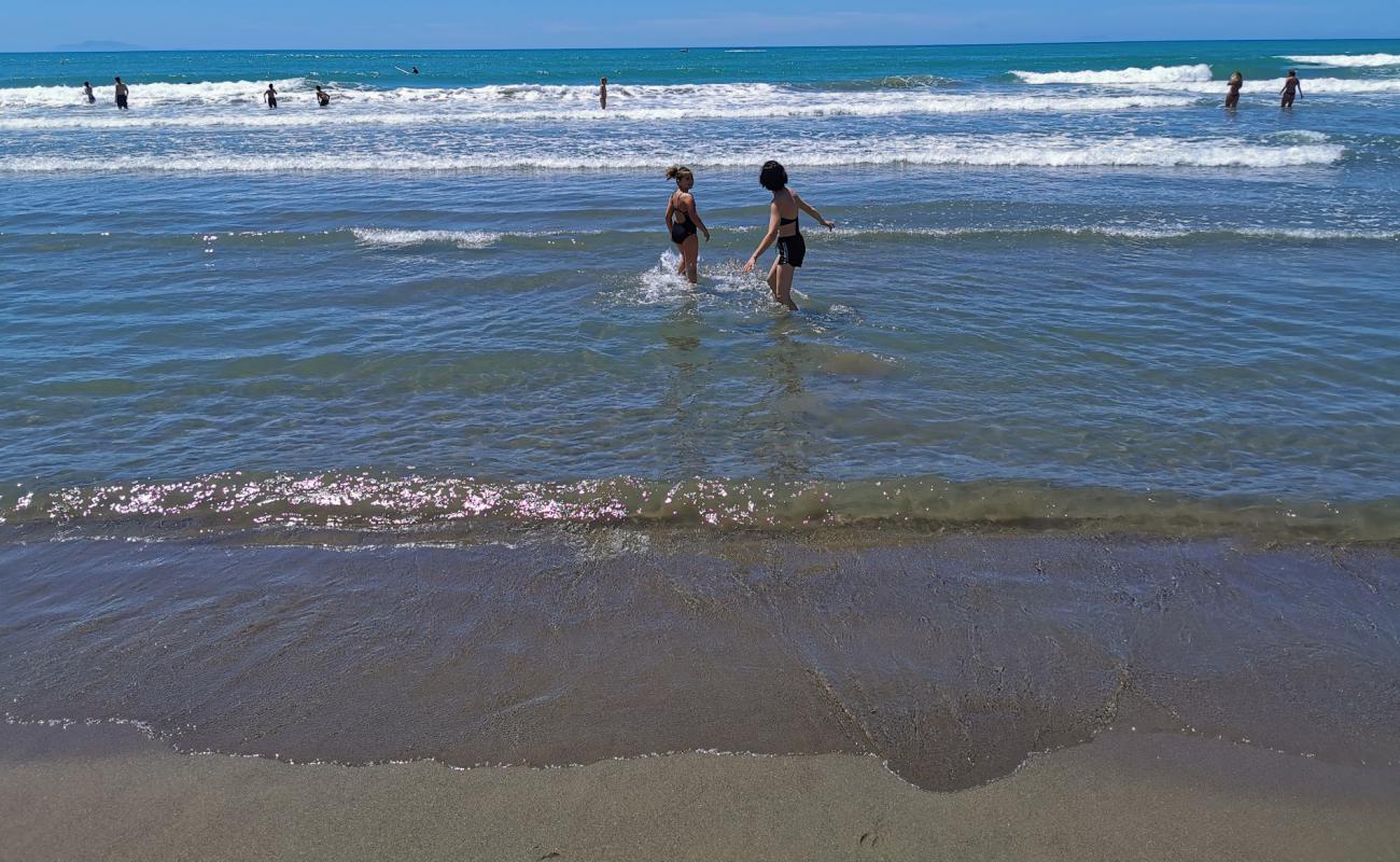 Photo of Castiglione della Pescaia with brown sand surface