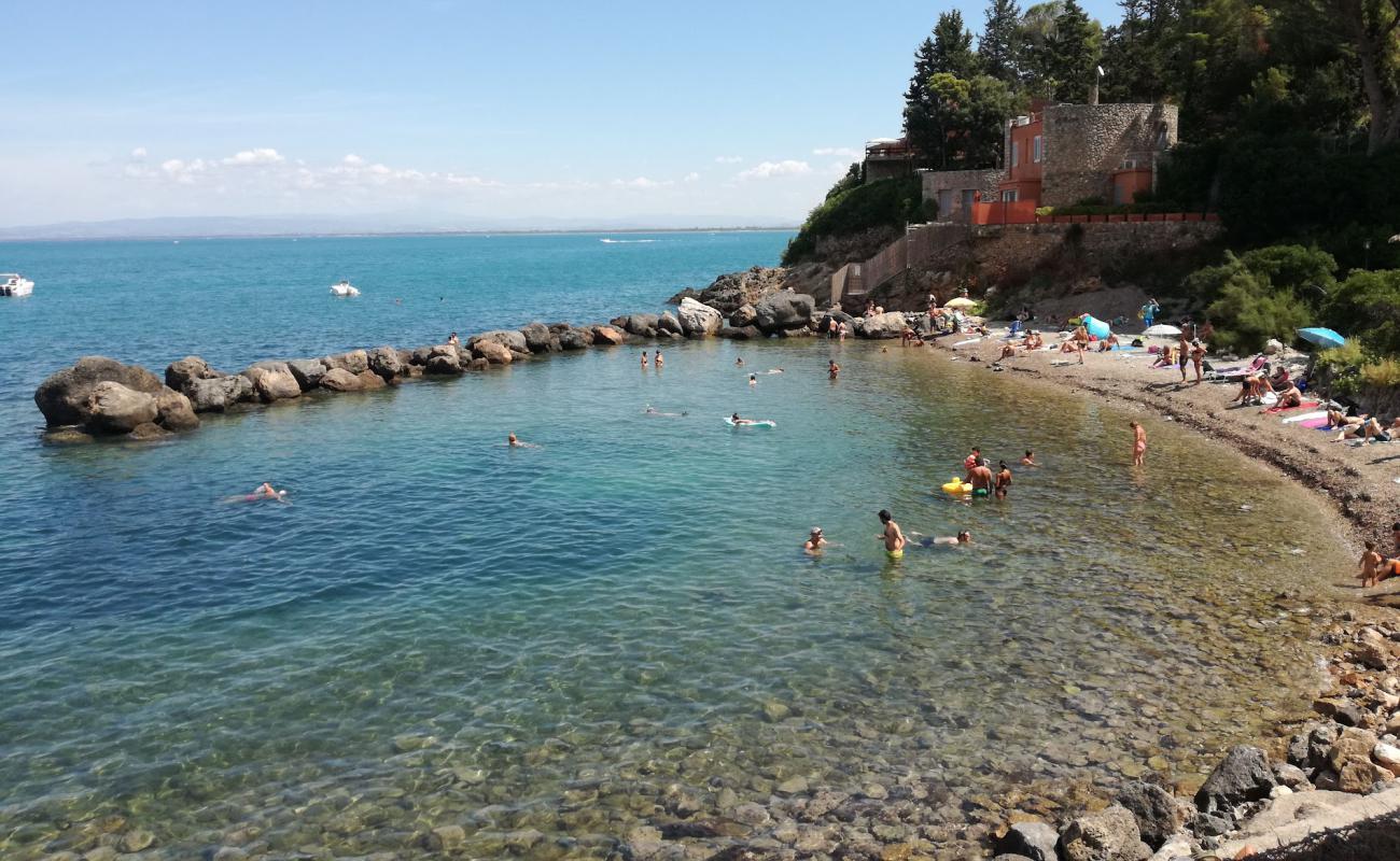 Photo of Spiaggia della Bionda with gray sand &  rocks surface