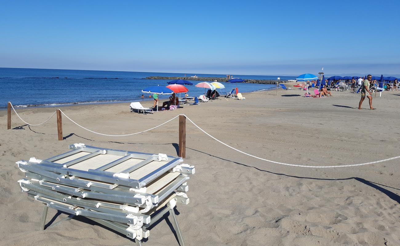 Photo of Focene beach with brown sand surface