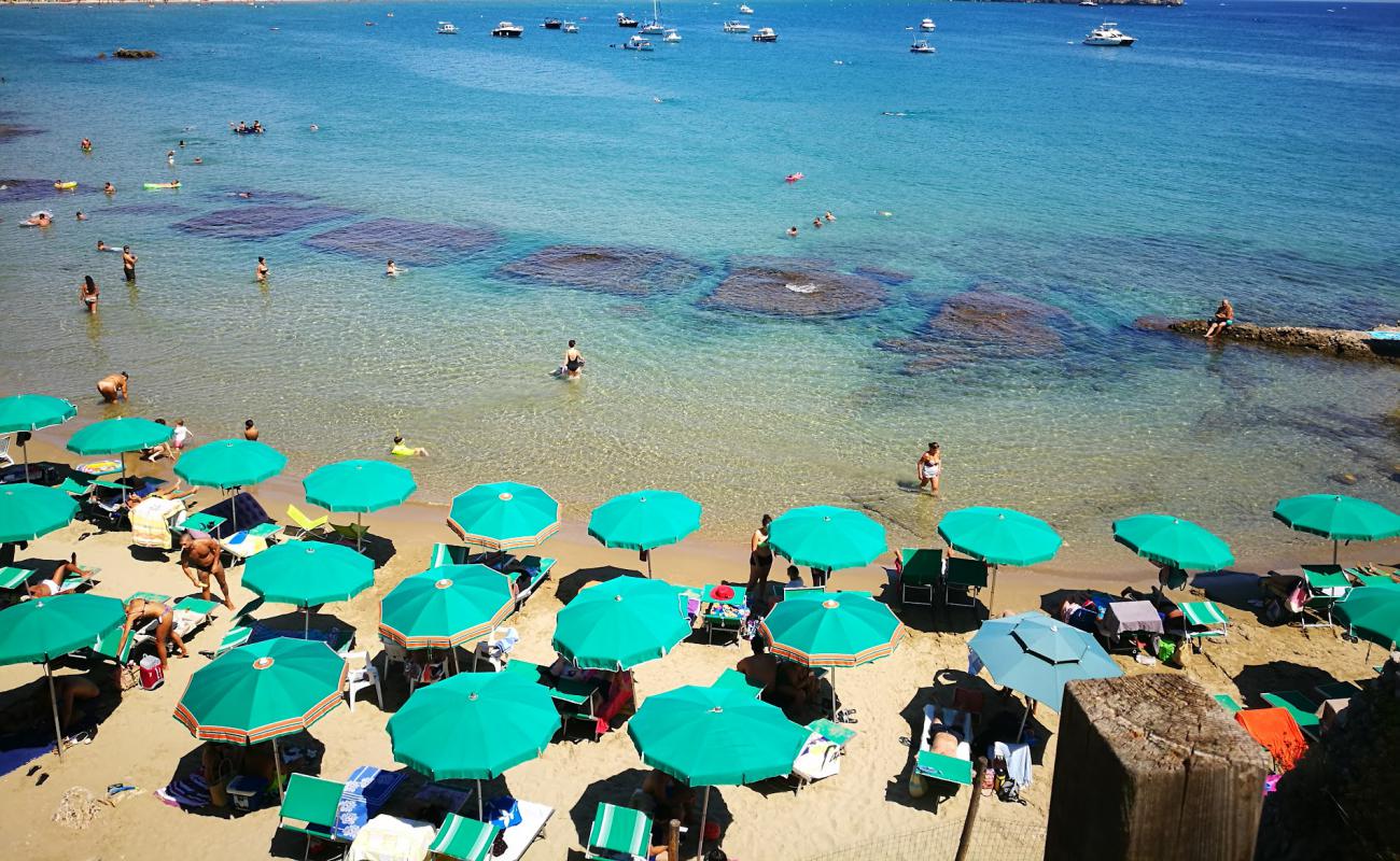 Photo of Spiaggia di Fontania with brown fine sand surface