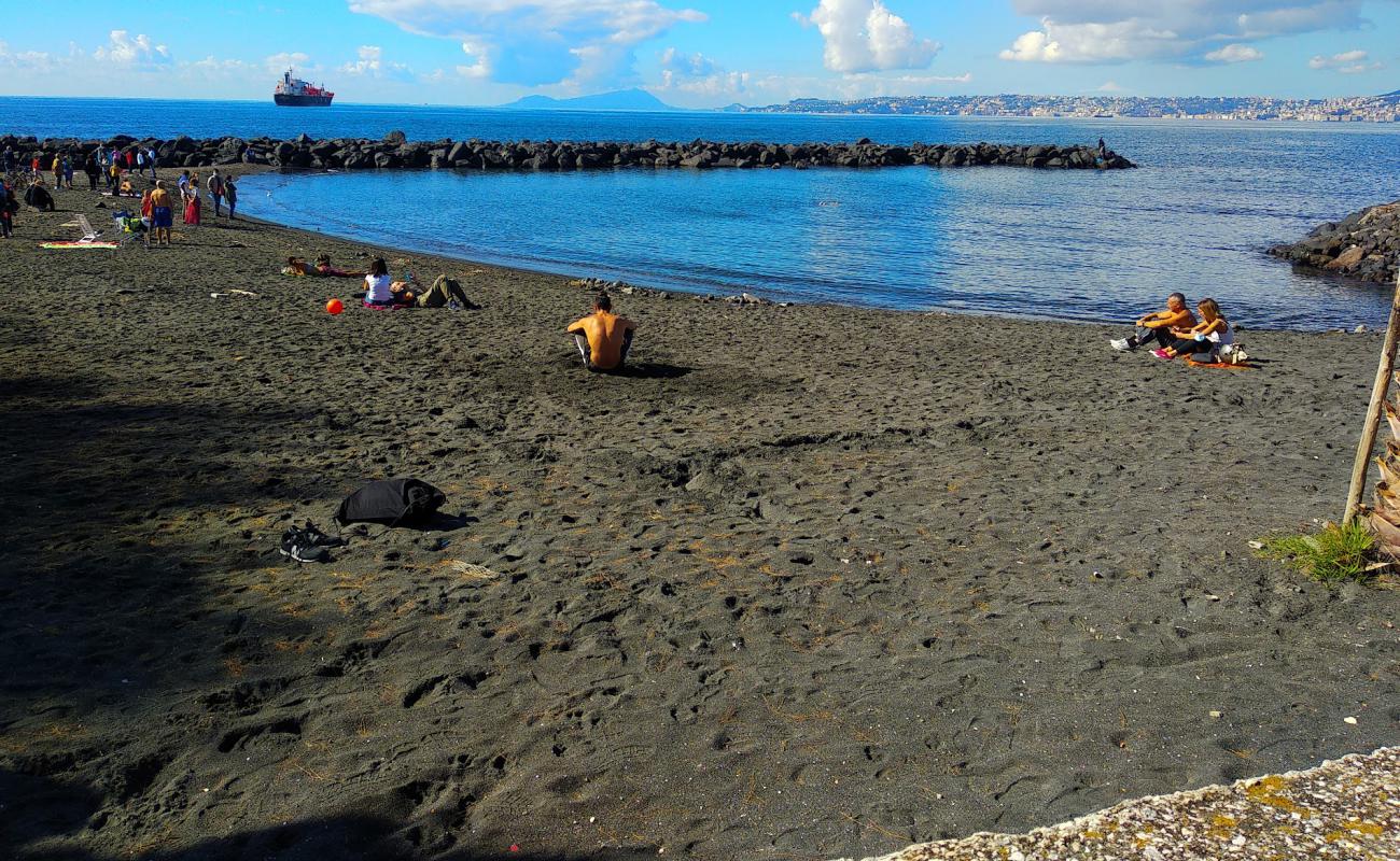 Photo of Spiaggia Delle Mortelle with gray sand surface