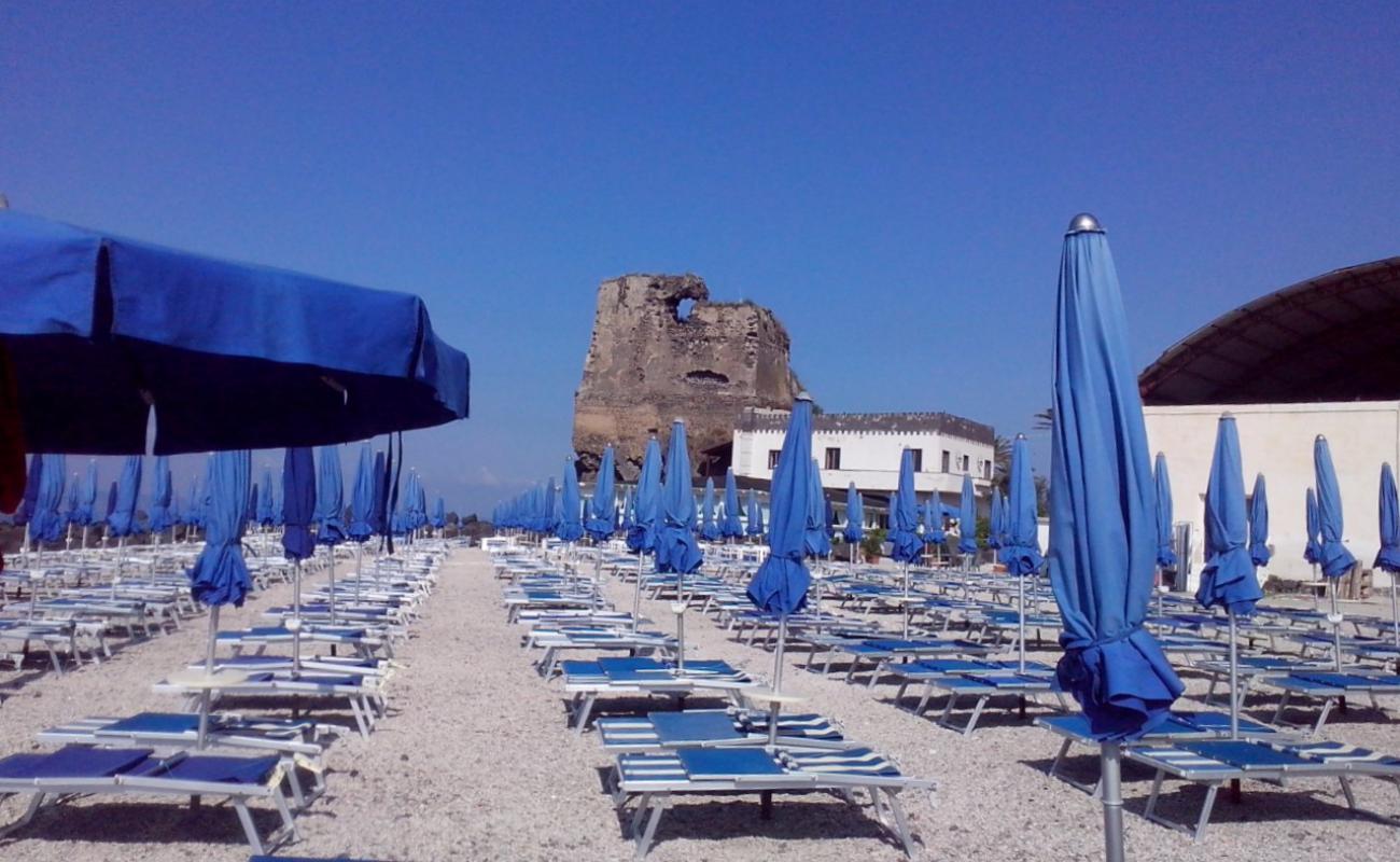 Photo of Torre Saracena with gray pebble surface