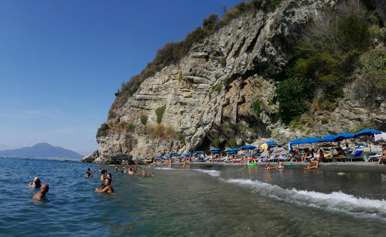 Photo of La Tartaruga beach with gray fine pebble surface