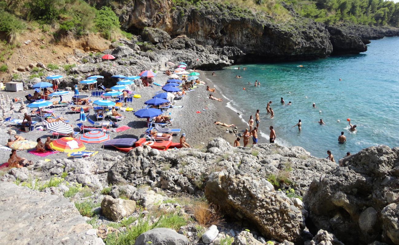 Photo of Spiaggia della Grotta with gray fine pebble surface