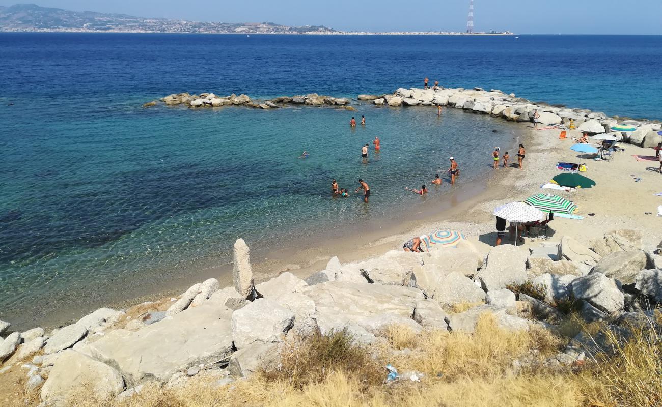 Photo of Porticello beach with brown sand surface