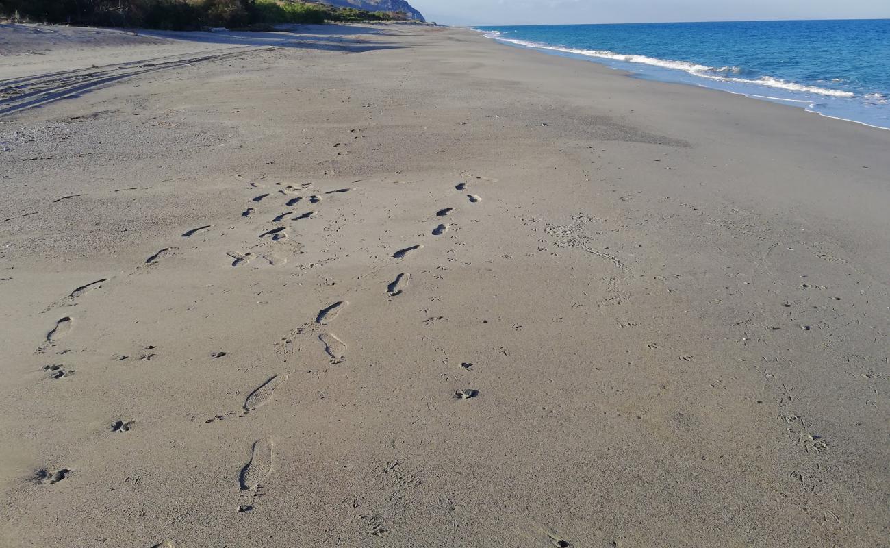 Photo of Spiaggia dello Scoglio Cuzzufri with gray sand surface