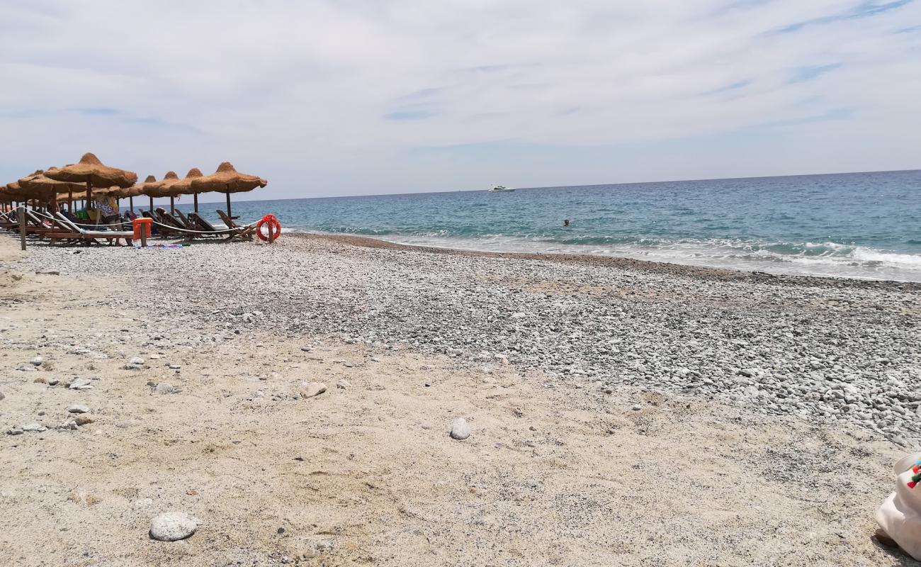 Photo of Riace Marina beach with brown fine pebble surface