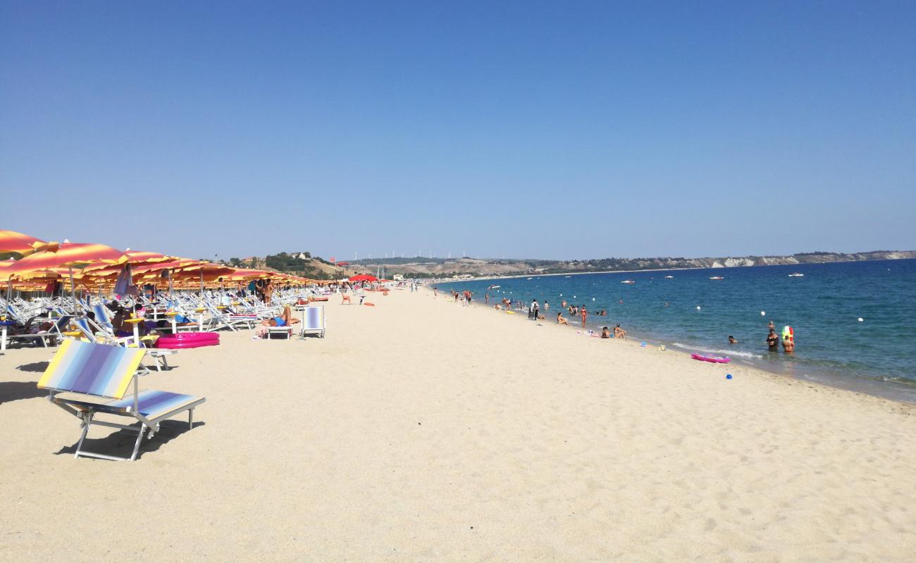 Photo of Serene Beach with bright sand surface