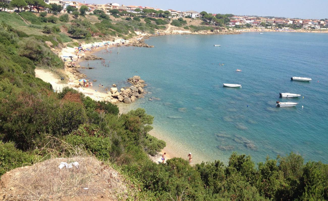 Photo of Capo Rizzuto beach with bright sand & rocks surface