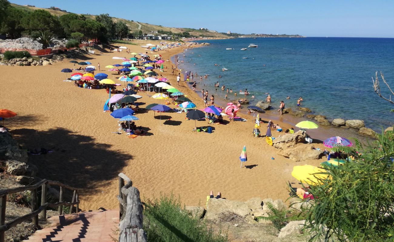 Photo of Spiaggia di Marinella with brown fine sand surface