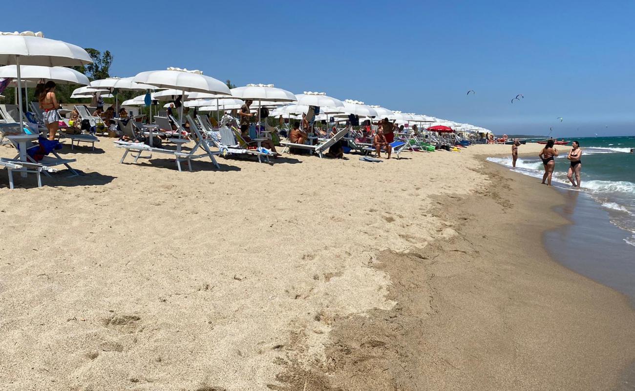 Photo of Crotone long beach with bright fine sand surface