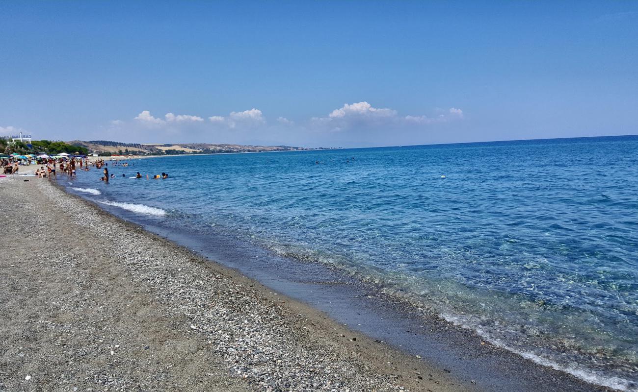 Photo of Antico beach with gray sand &  pebble surface