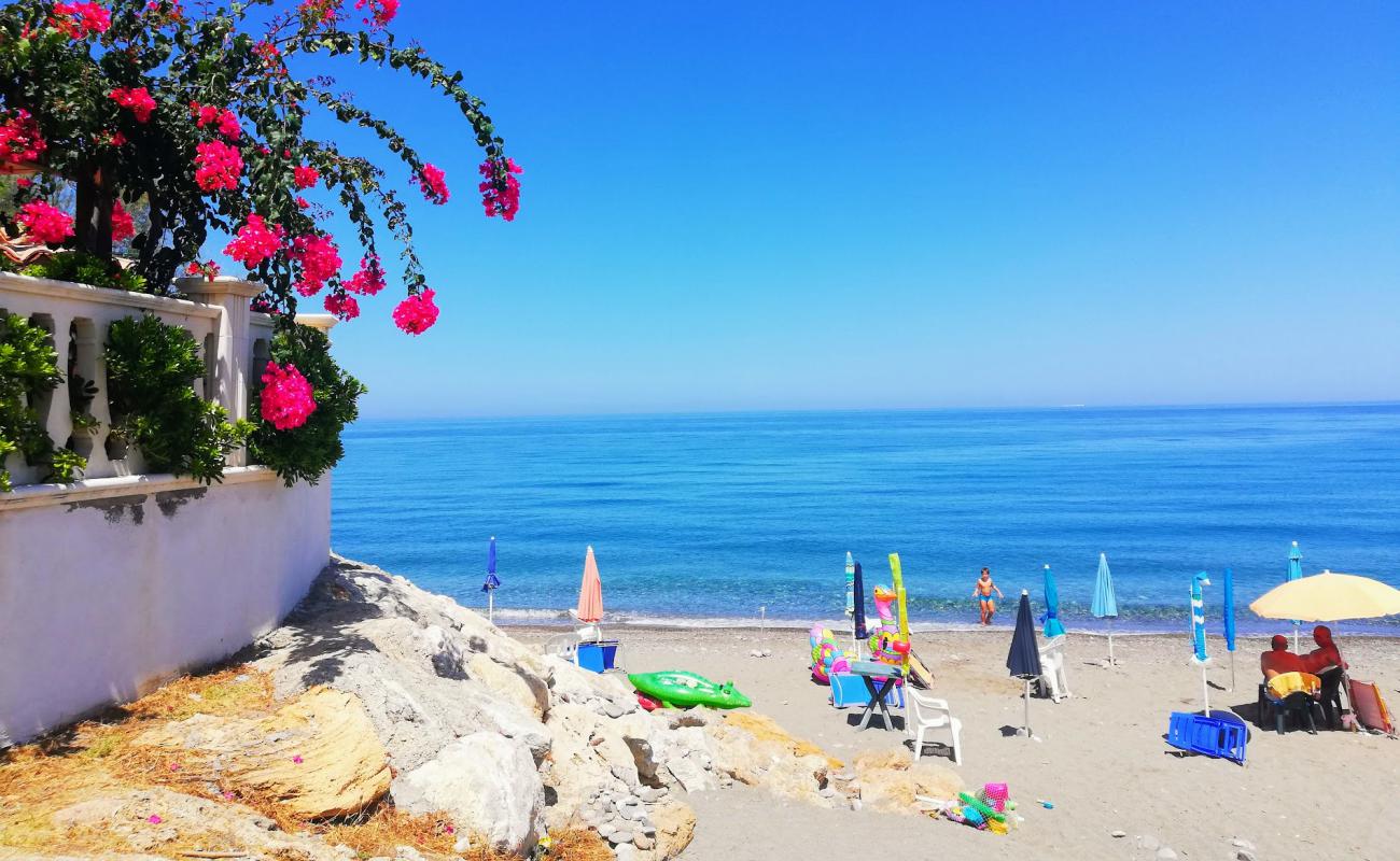 Photo of Mirto beach with gray sand &  pebble surface