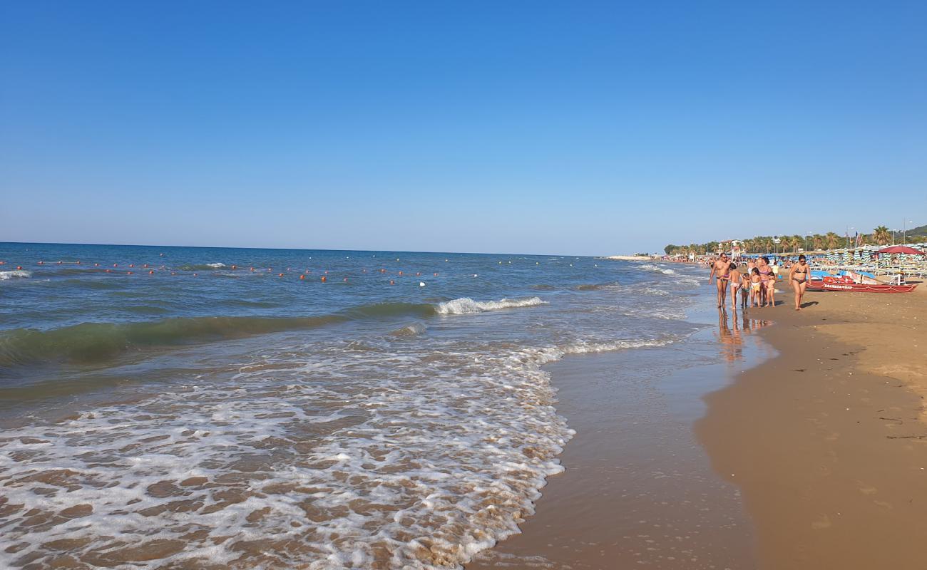 Photo of Spiaggia di Lido del Sole with brown sand surface