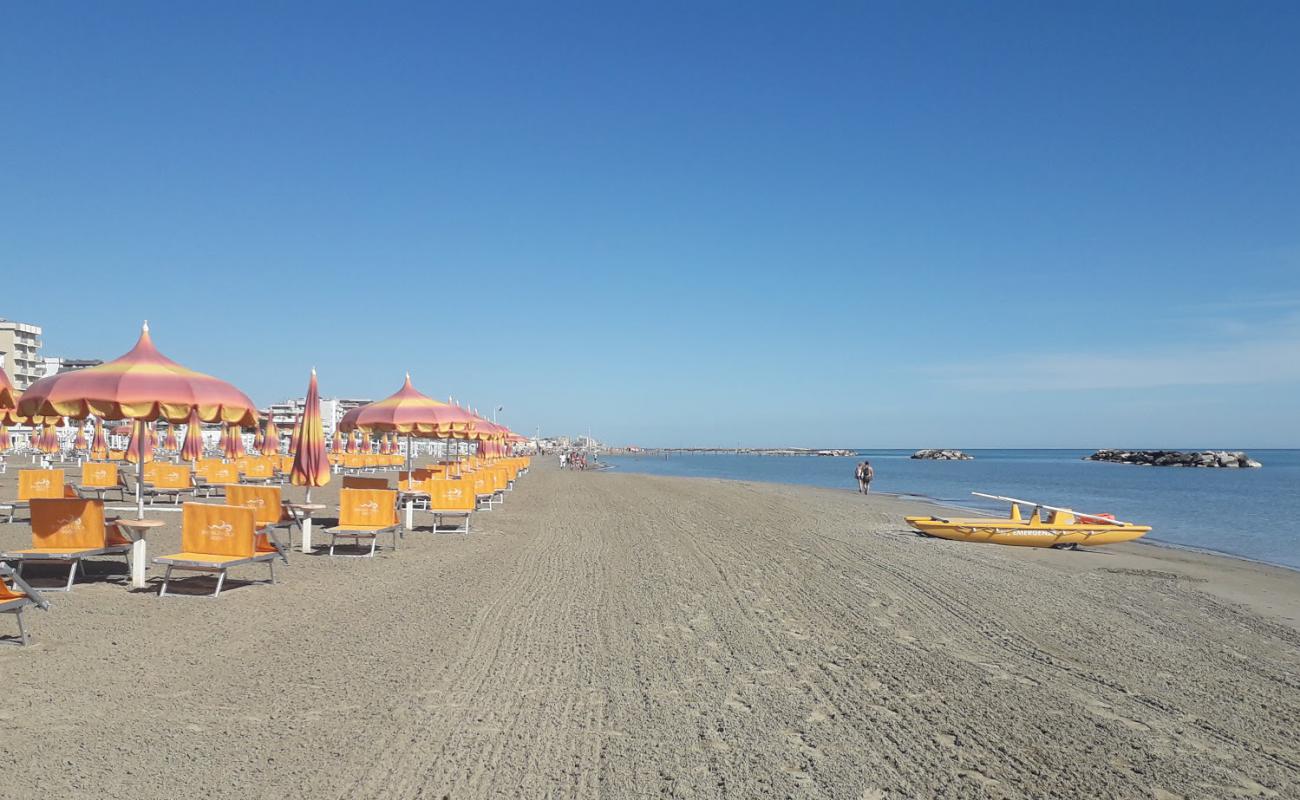 Photo of Torre pedrera beach with bright fine sand surface