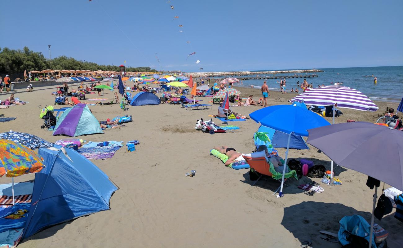 Photo of Caorle beach with bright sand surface