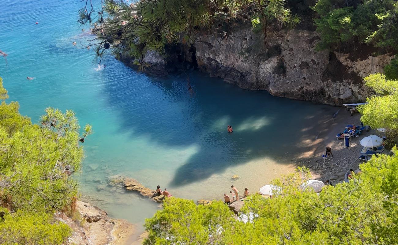 Photo of Cala Matano with brown sand surface