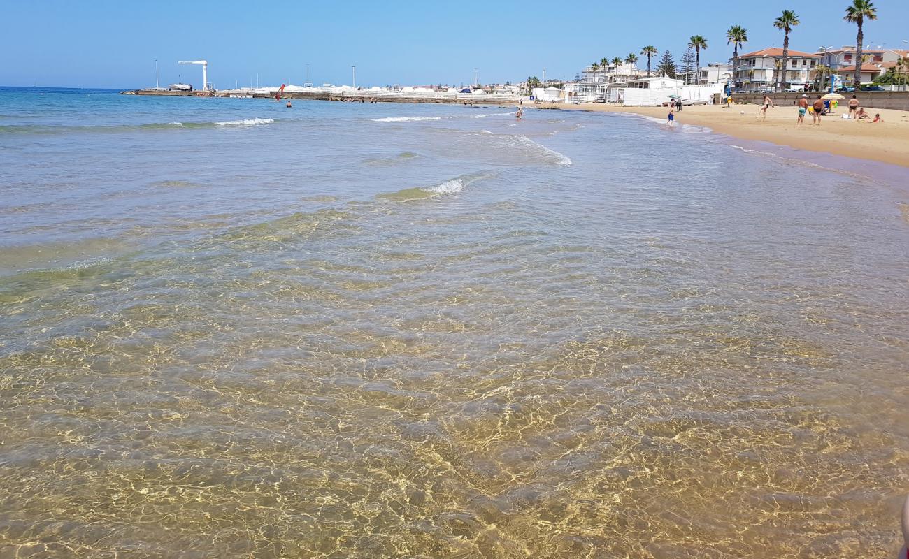 Photo of Marina di Ragusa with bright fine sand surface