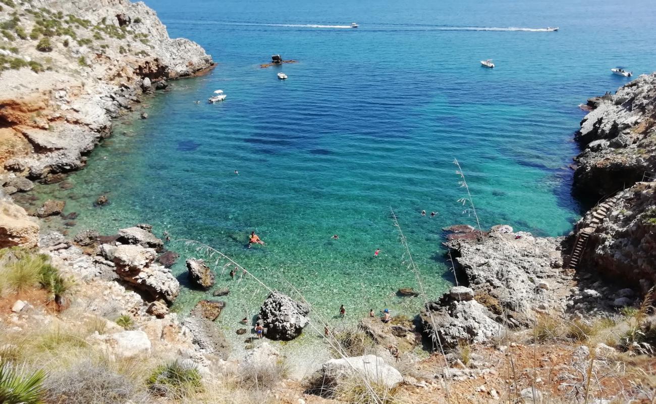 Photo of Cala Rossa with rocks cover surface