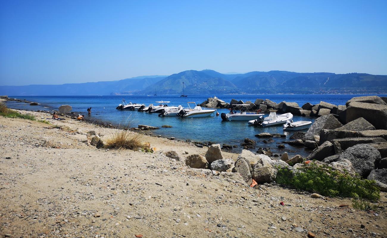 Photo of Torre Faro Messina with gray sand &  rocks surface