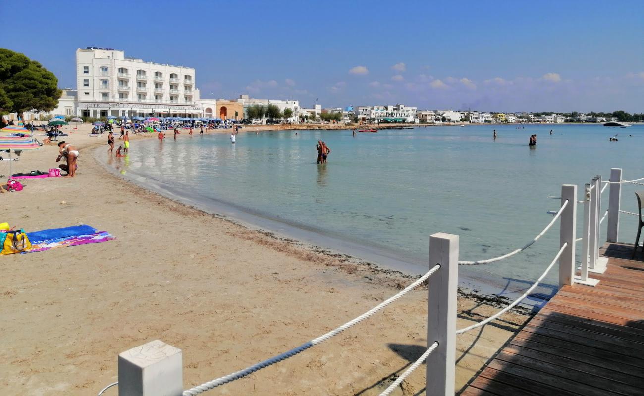 Photo of Porto Cesareo beach with bright fine sand surface