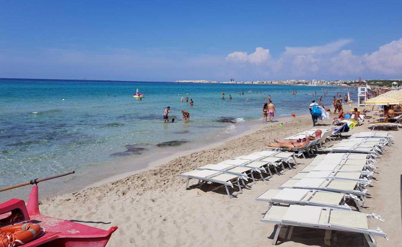 Photo of Spiaggia di Baia Verde with bright sand surface