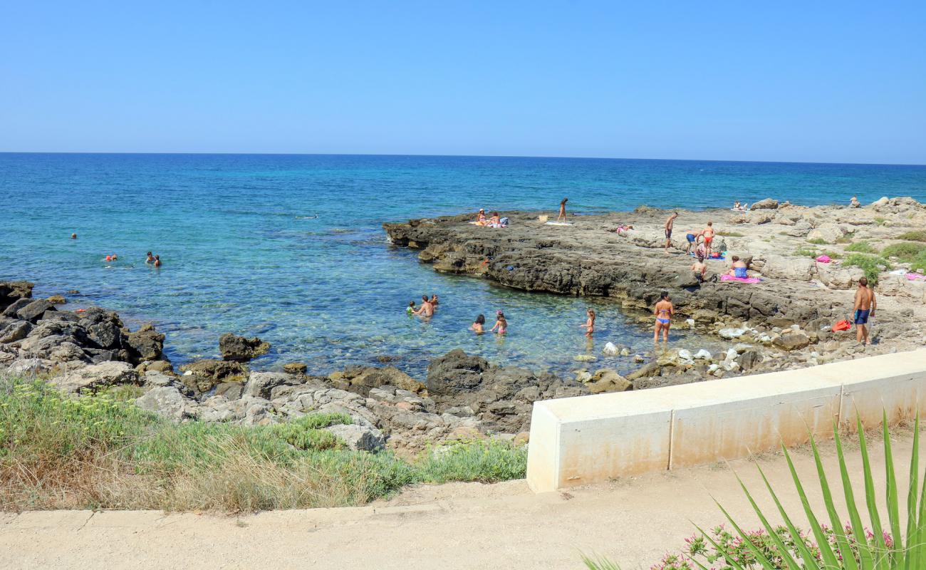 Photo of Jinetto beach with rocks cover surface