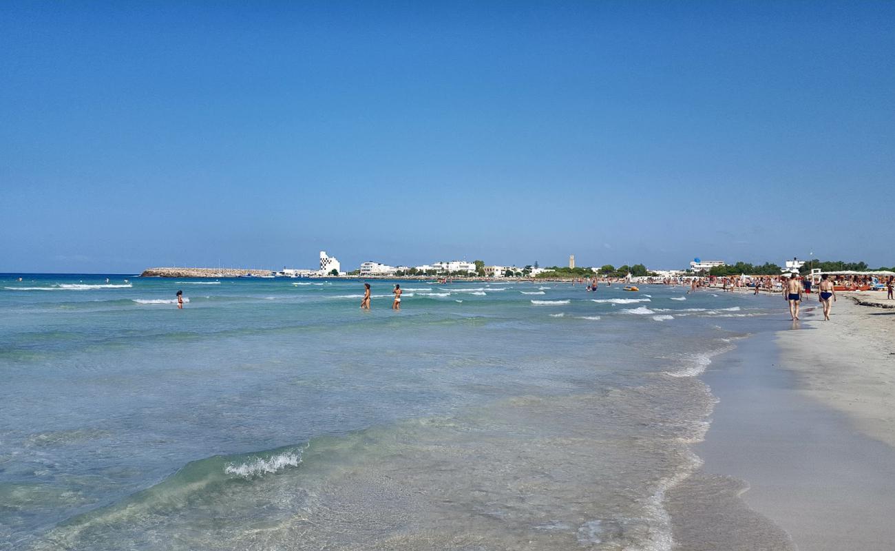 Photo of Torre San Giovanni Beach with bright fine sand surface