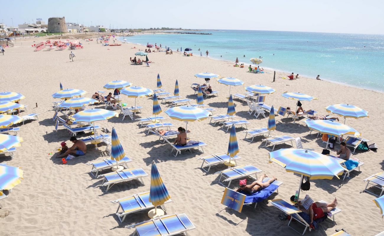 Photo of Spiaggia di Torre Mozza with bright fine sand surface