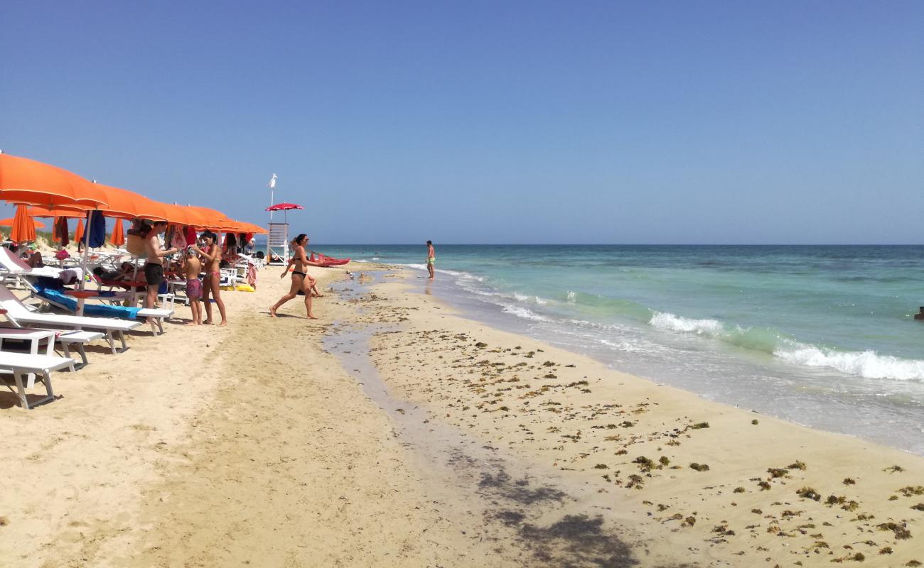 Photo of beach Torre Pali with bright fine sand surface