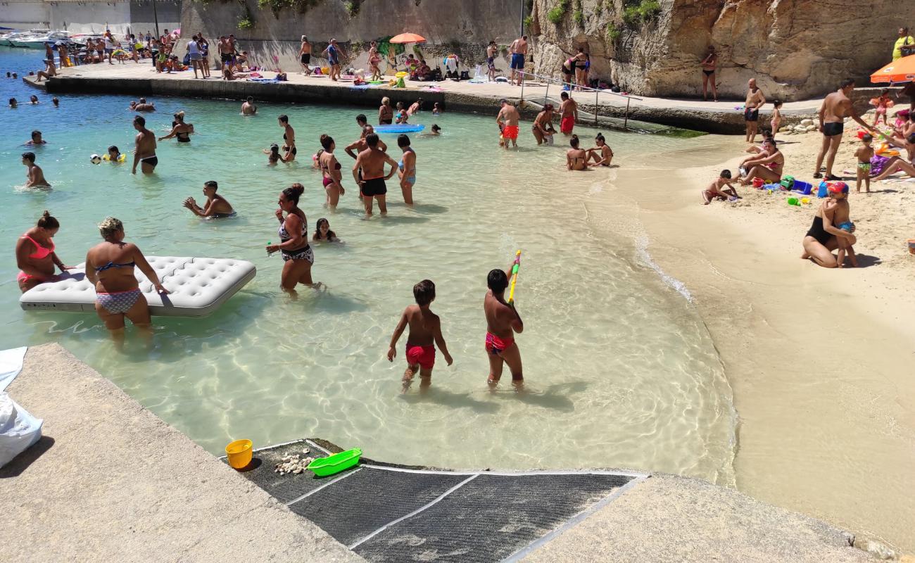 Photo of beach Tricase Porto with bright fine sand surface