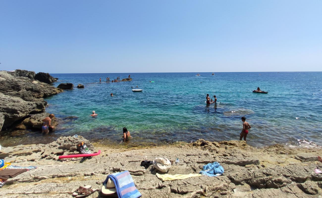 Photo of Spiaggia di Chianca Liscia with rocks cover surface