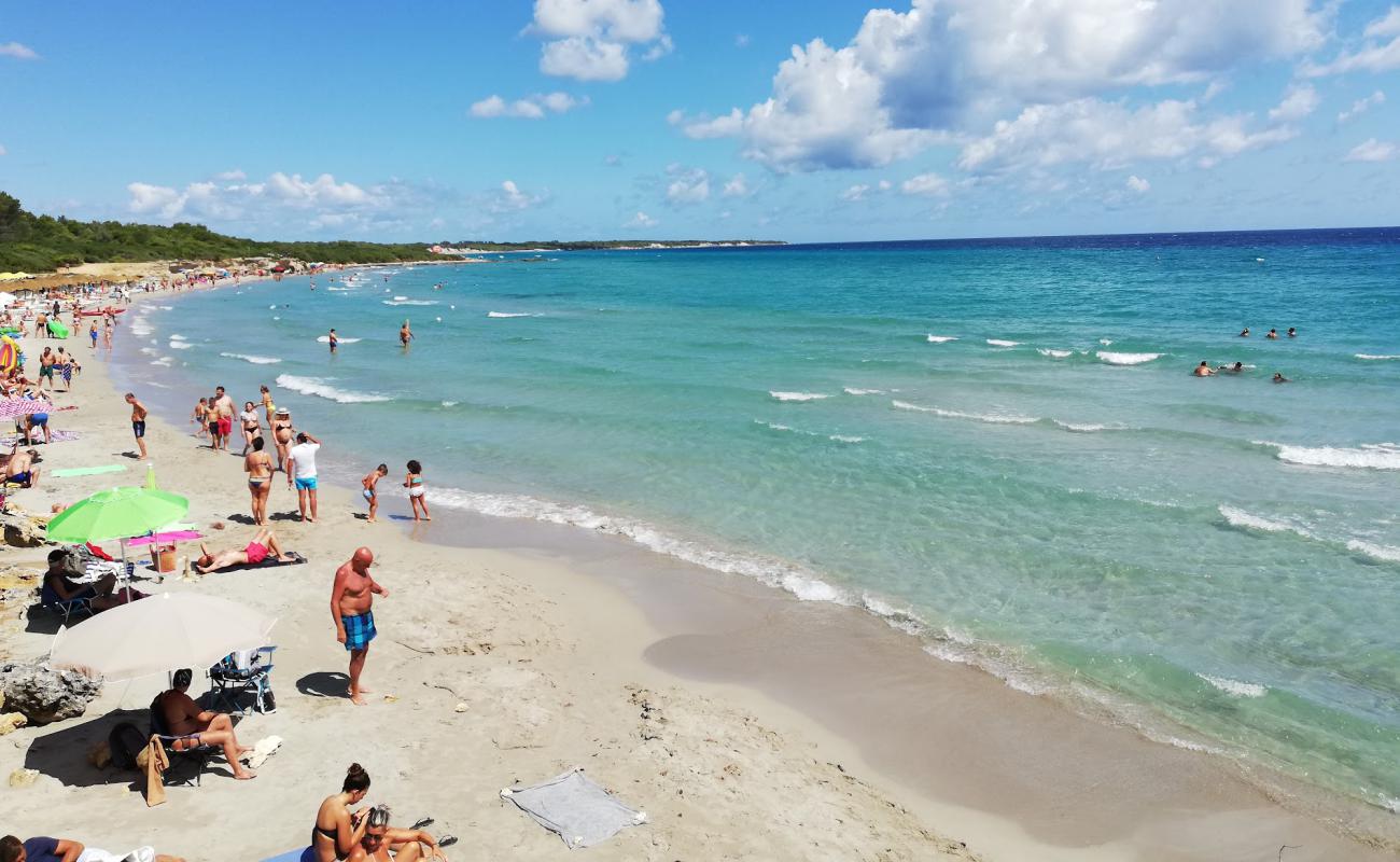 Photo of Spiaggia Baia dei Turchi with bright sand surface