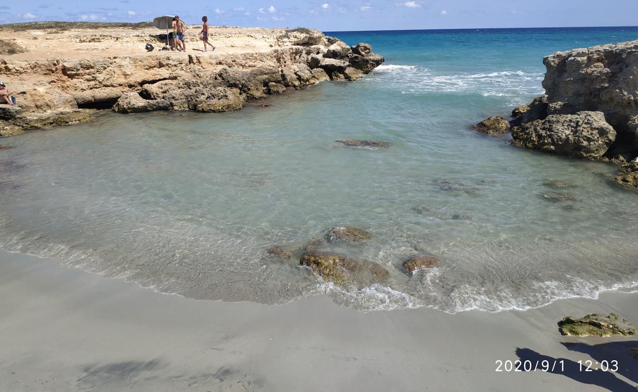 Photo of Caletta segreta with bright sand surface