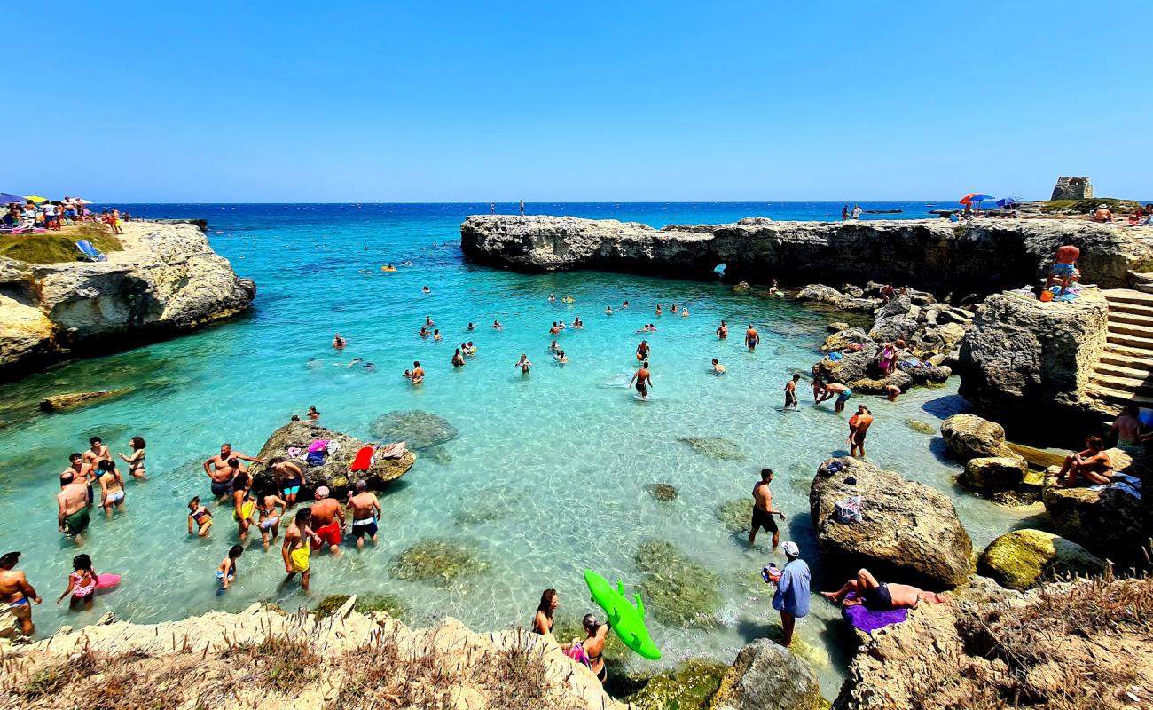 Photo of Spiaggia di Portulignu with rocks cover surface