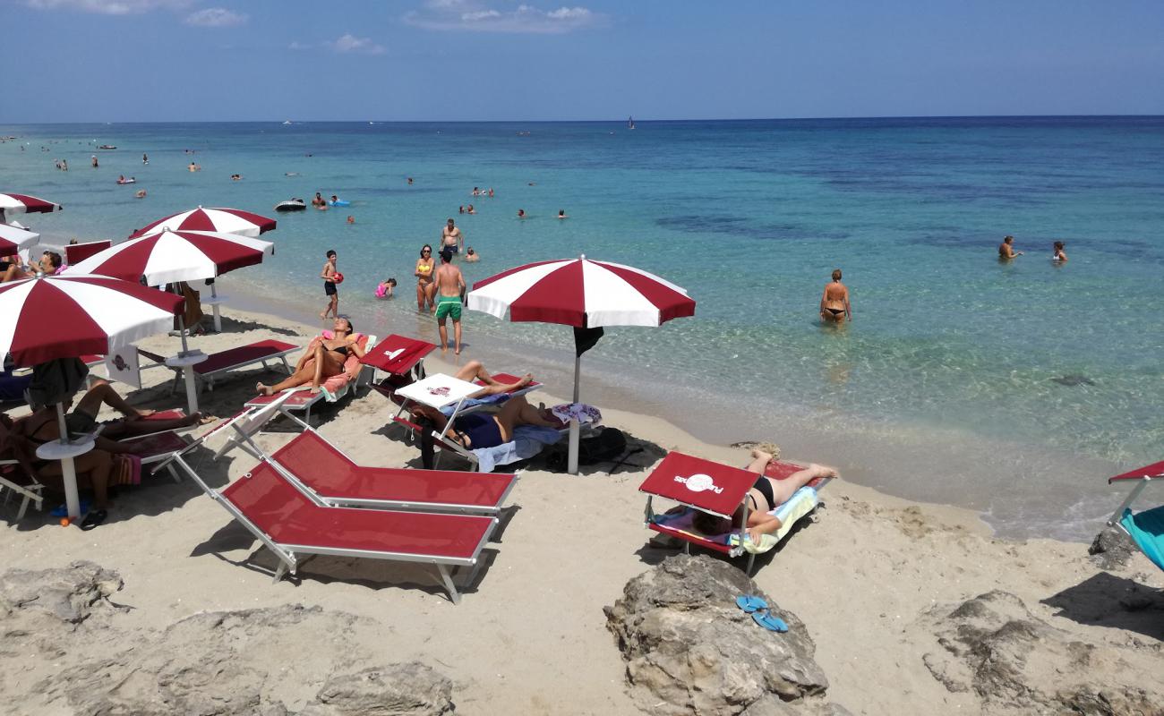 Photo of Spiaggia di Torre Specchia with bright sand surface