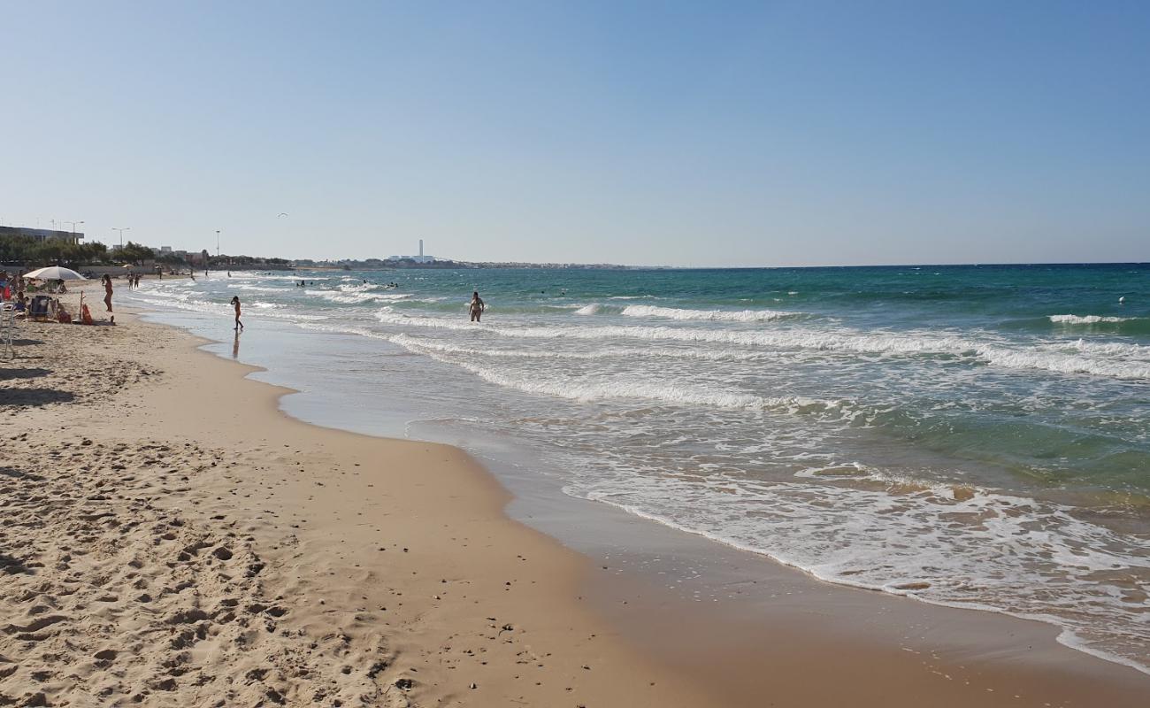 Photo of Benny beach with bright fine sand surface