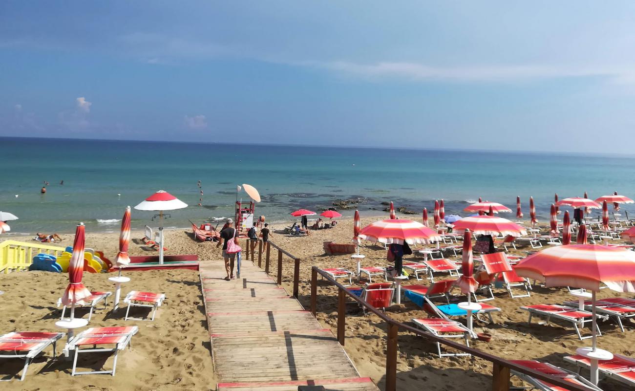 Photo of Spiaggia Via di Torre Resta with bright fine sand surface