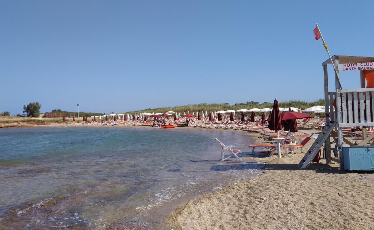 Photo of Torre Santa Sabina beach with bright sand surface