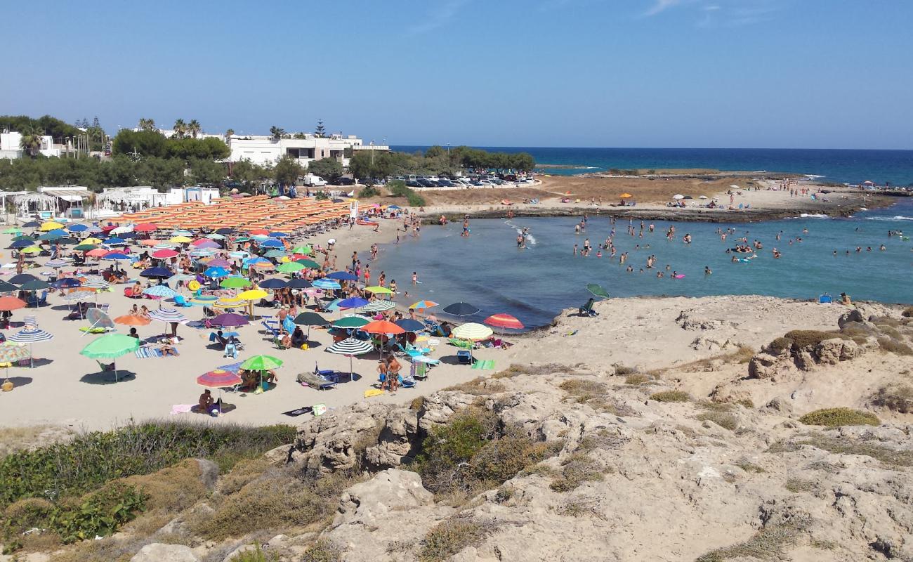 Photo of Spiaggia Mezzaluna with bright sand surface