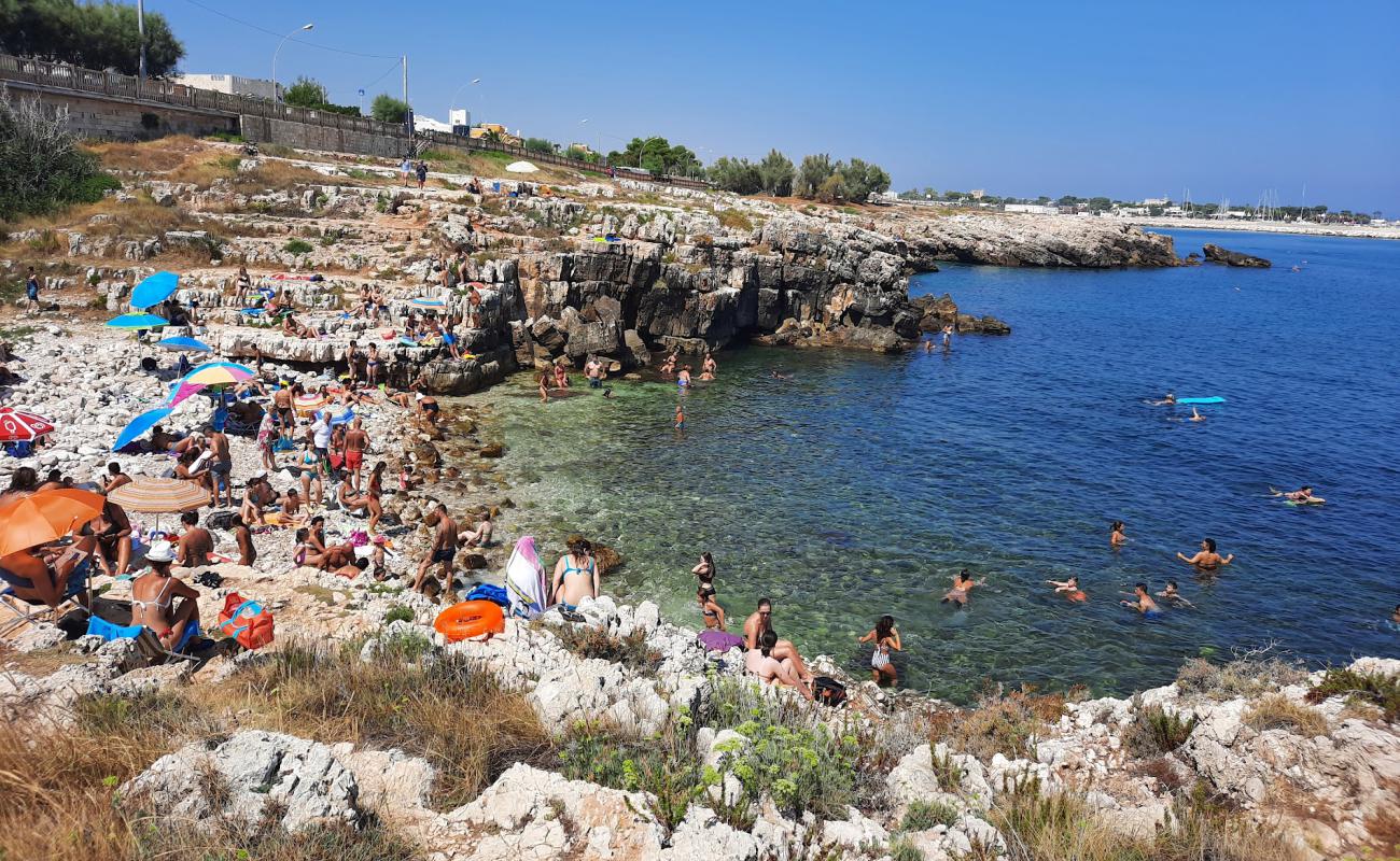 Photo of Ponte dei Lapilli beach with rocks cover surface