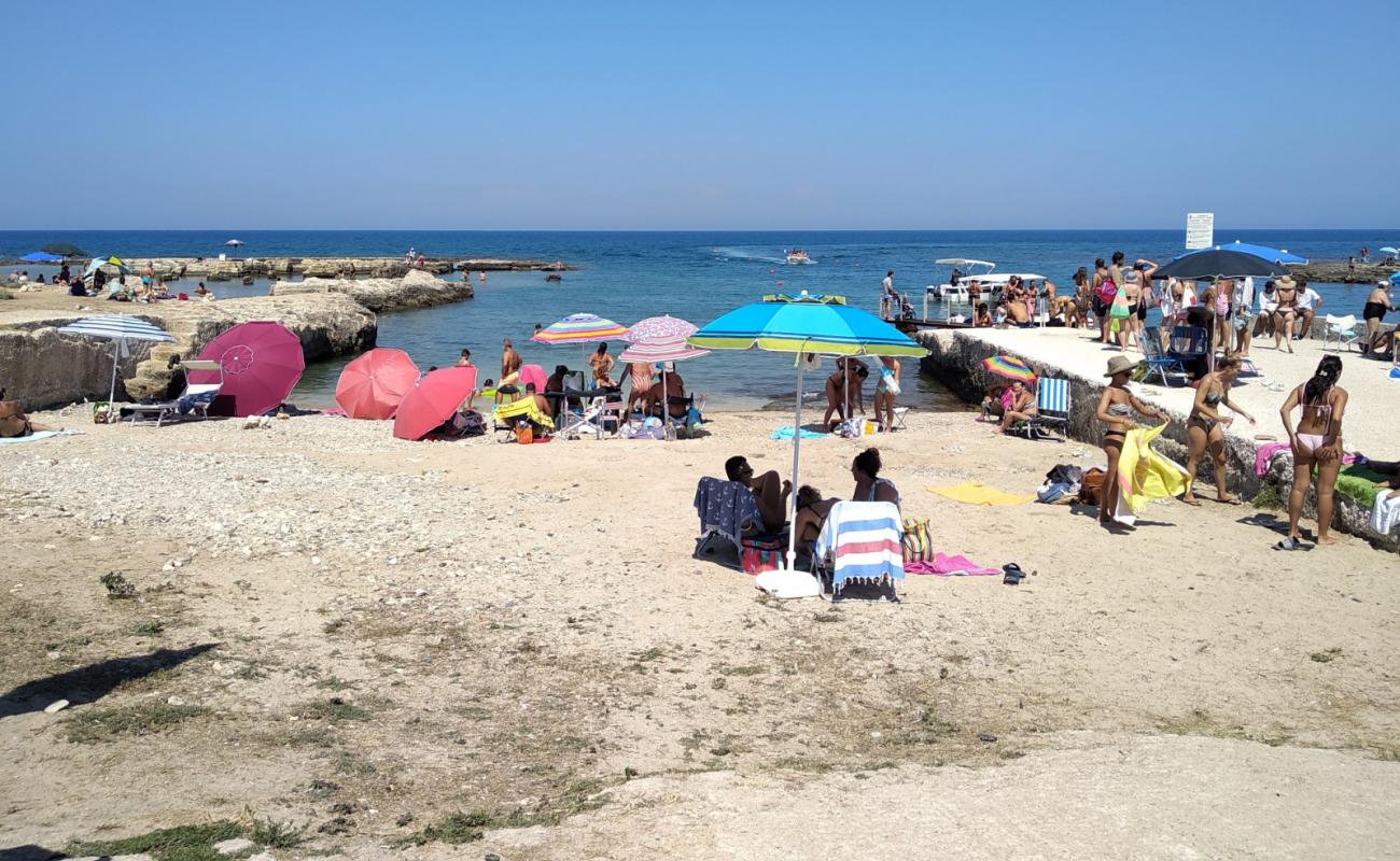 Photo of Torre San Vito beach with bright sand & rocks surface