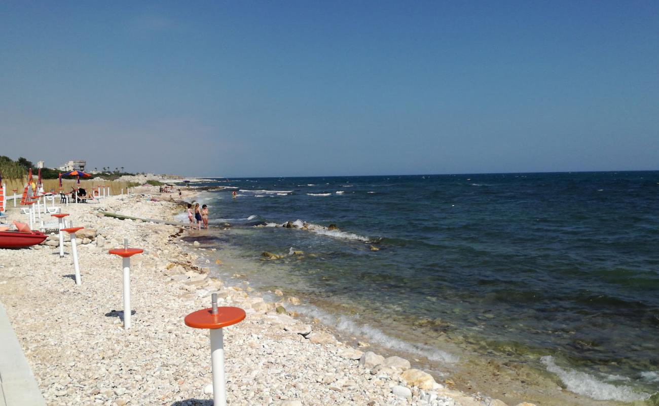 Photo of Arena beach with rocks cover surface